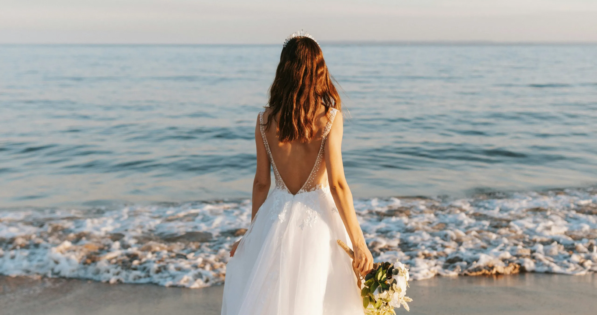 A bride looking out at the sea